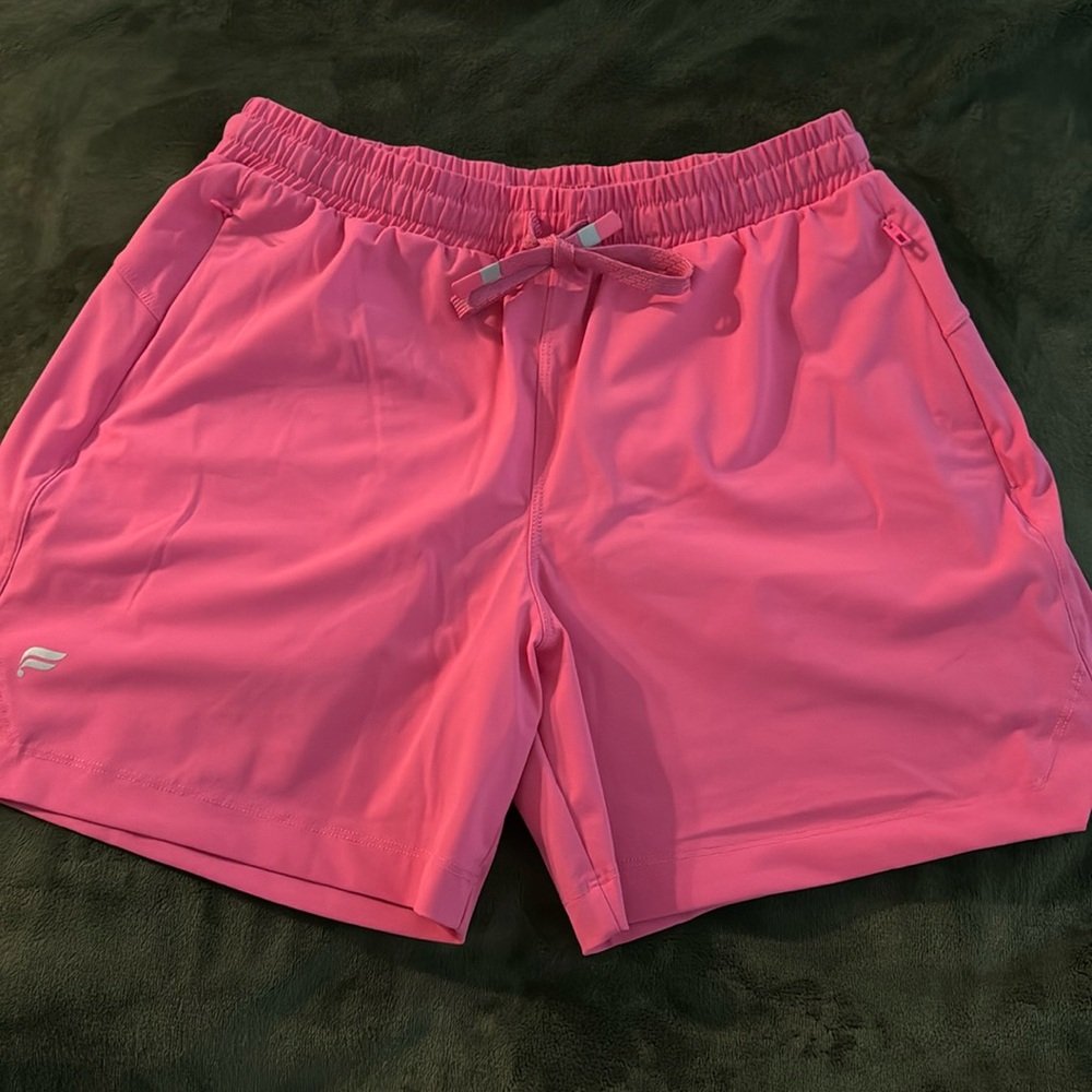 XS Fabletics shorts. Pink, 2 zipper pocket. Pink & reflective grey drawstring.